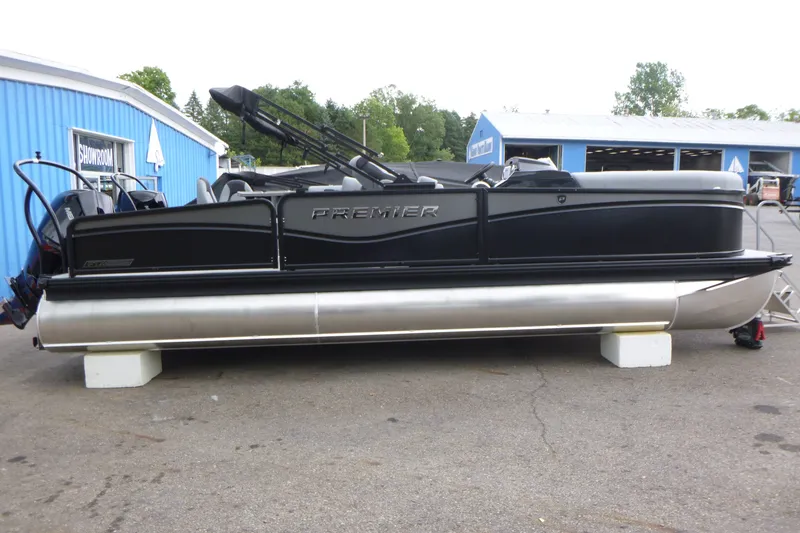 The Image of 2027 Premier 230 Sunsation RS - CL pontoon boat displayed outside showroom. - 1