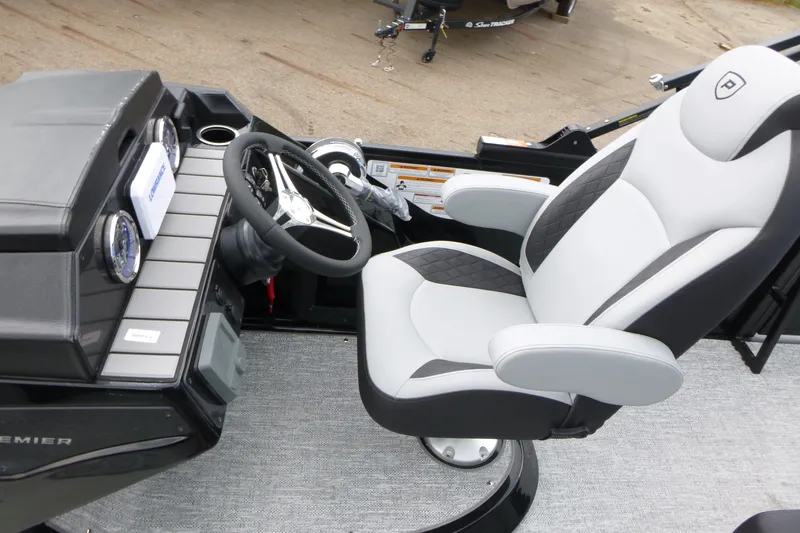 Slide: The Image of Captain's chair and dashboard of 2027 Premier 230 Sunsation RS - CL boat. - 14