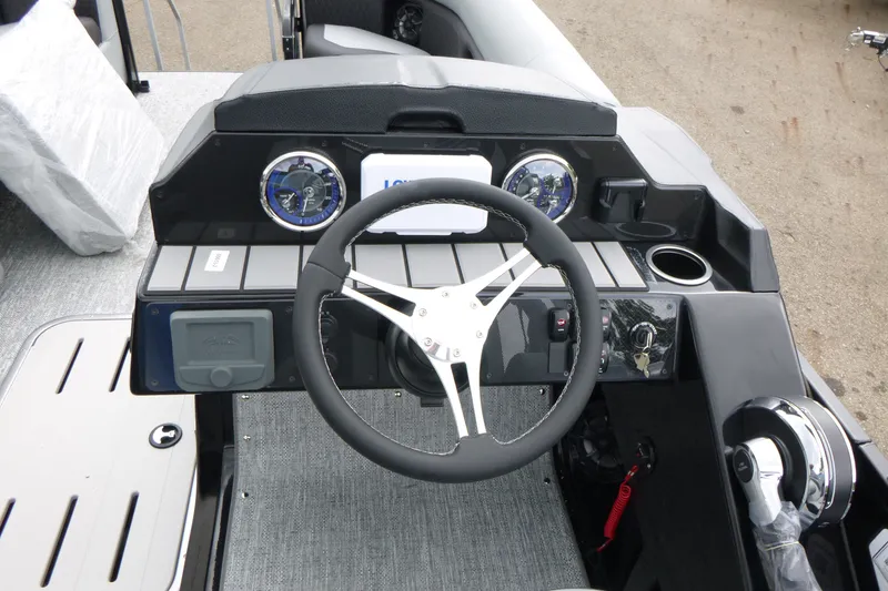Slide: The Image of Steering console of 2027 Premier 230 Sunsation RS - CL boat with modern controls and gauges. - 15