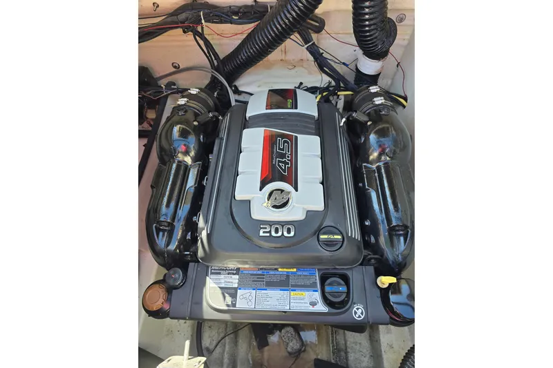 Slide: The Image of 2019 Bayliner VR6 Bowrider I/O engine, showcasing a powerful 4.5L 200 HP MerCruiser. - 14