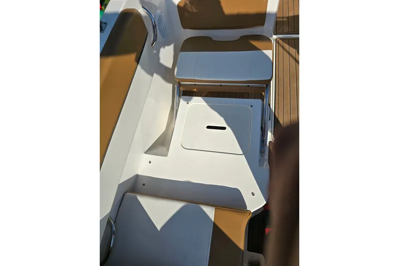 Slide: The Image of 2019 Bayliner VR6 Bowrider I/O interior with tan seating and white deck. - 13
