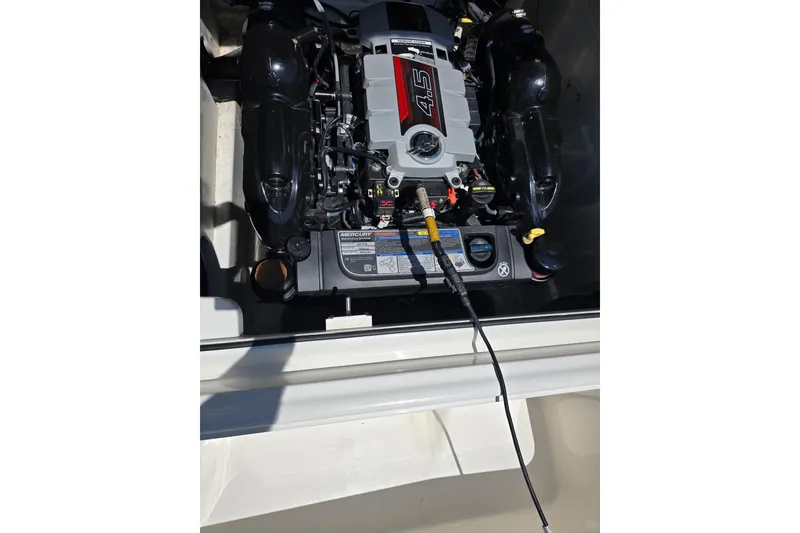 Slide: The Image of 2019 Bayliner VR6 Bowrider I/O engine compartment with Mercury 4.5L engine. - 20