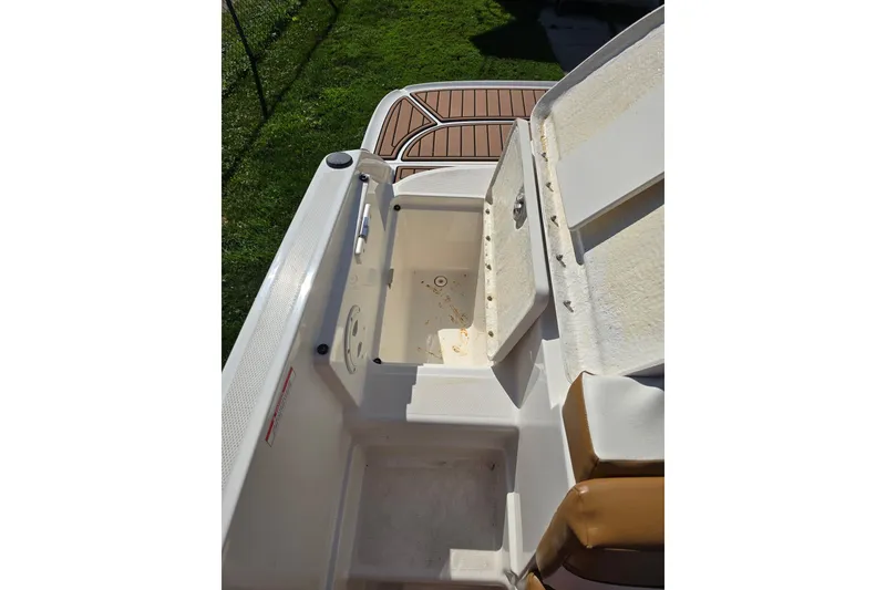 Slide: The Image of 2019 Bayliner VR6 Bowrider I/O boat interior with open storage compartment. - 8