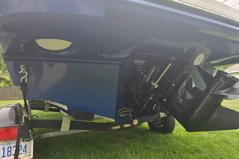 Slide: The Image of 2019 Bayliner VR6 Bowrider I/O boat on trailer, showing rear and propeller. - 17