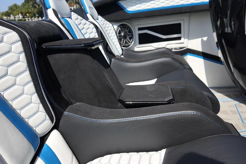 Slide: The Image of Luxurious interior of Doug Wright 420, 2027 model, featuring sleek black and white seating. - 18
