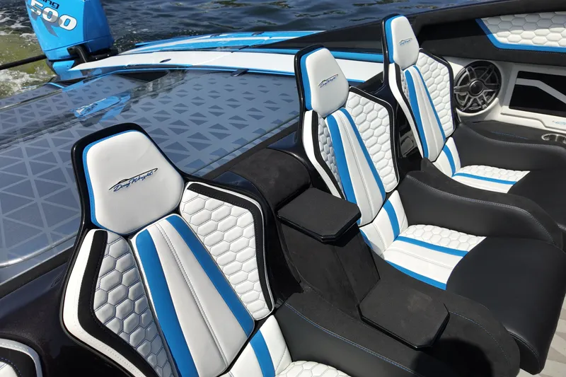 Slide: The Image of Luxury seating in a 2027 Doug Wright 420 boat with blue and white accents. - 15