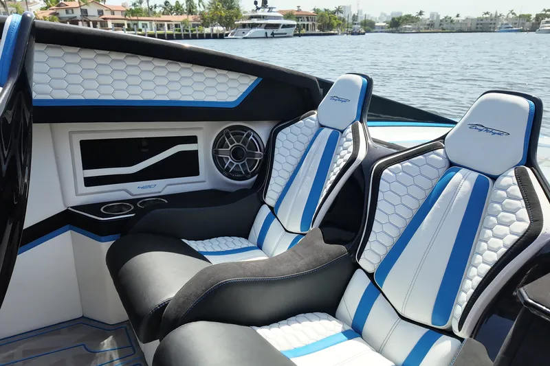 Slide: The Image of Luxury interior of 2027 Doug Wright 420 boat with stylish blue and white seating. - 14