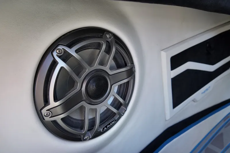 Slide: The Image of Close-up of a JL Audio speaker in a 2027 Doug Wright 420 boat interior. - 23