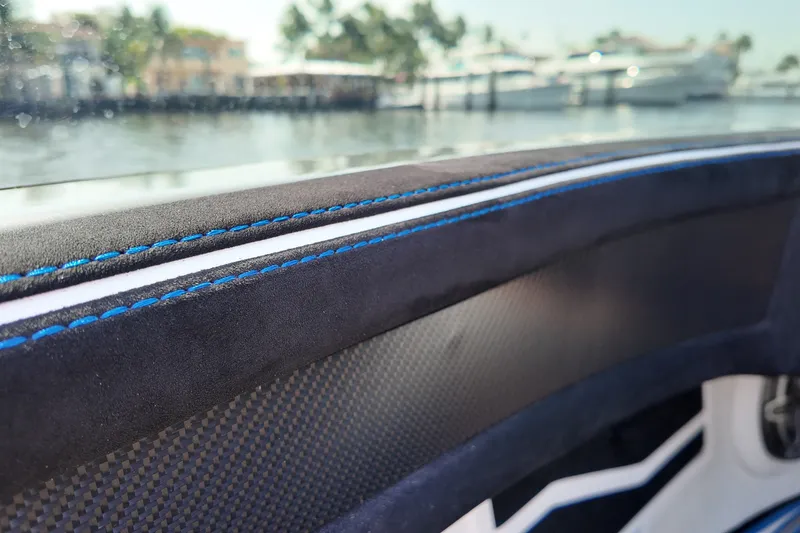 Slide: The Image of Interior detail of 2027 Doug Wright 420 boat with blue stitching and carbon fiber accents. - 24