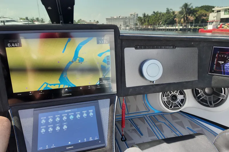 Slide: The Image of Dashboard of a 2027 Doug Wright 420 boat with Garmin navigation displays. - 21