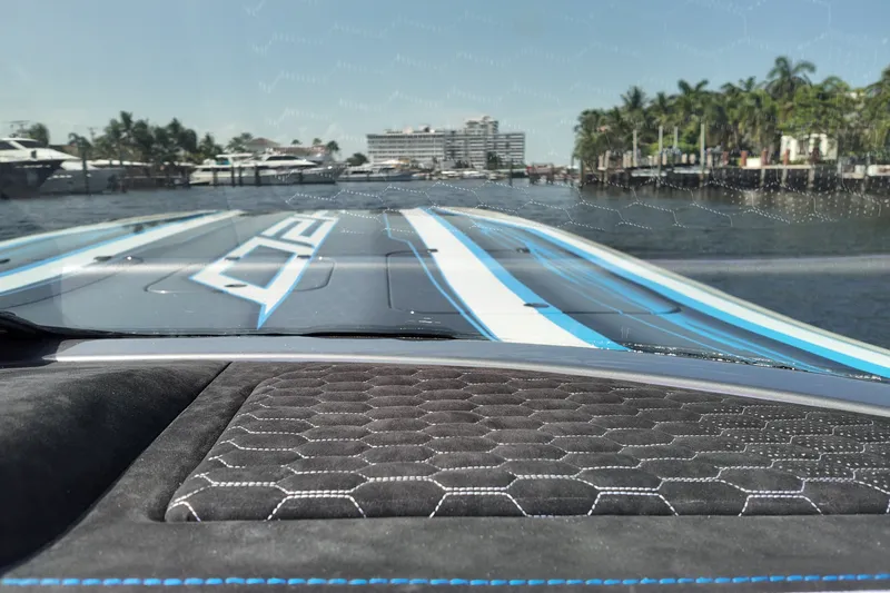 Slide: The Image of Interior view of 2027 Doug Wright 420 boat, featuring sleek dashboard and waterfront scenery. - 22