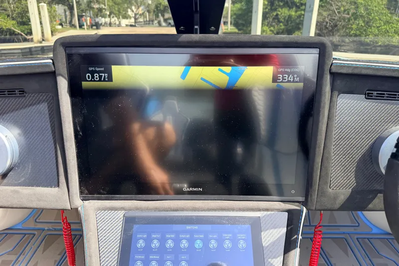 Slide: The Image of Dashboard of a 2027 Doug Wright 420 boat with Garmin GPS display. - 26