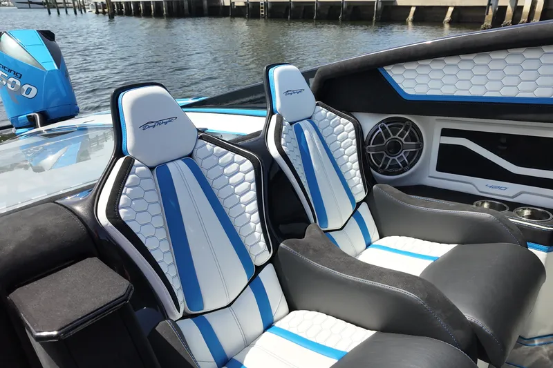Slide: The Image of Luxury interior of 2027 Doug Wright 420 boat with stylish blue and white seating. - 13