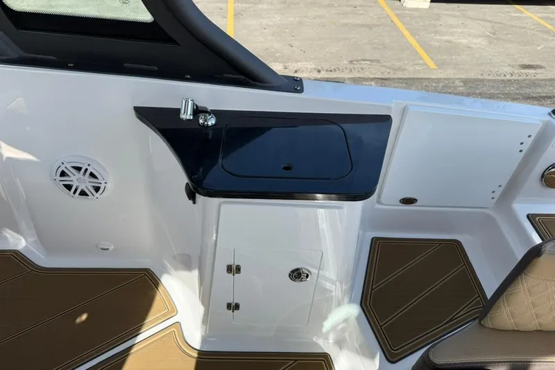 Slide: The Image of Interior of 2026 Monterey Elite 27 SD boat with sink and storage. - 14
