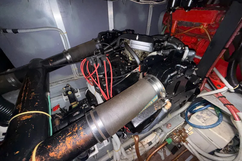 Slide: The Image of Engine compartment of a 1987 Sea Ray 410 Aft Cabin boat, showing mechanical components. - 38