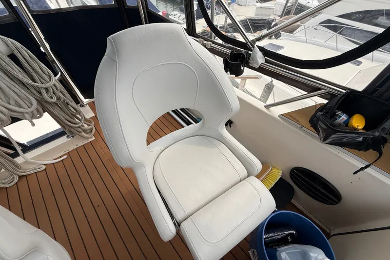 Slide: The Image of White captain's chair on 1987 Sea Ray 410 Aft Cabin yacht deck. - 50