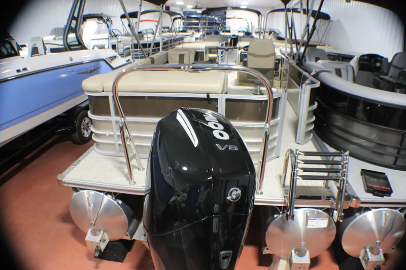 Slide: The Image of 2025 Berkshire 24CL CTS pontoon boat with powerful outboard motor in showroom. - 4