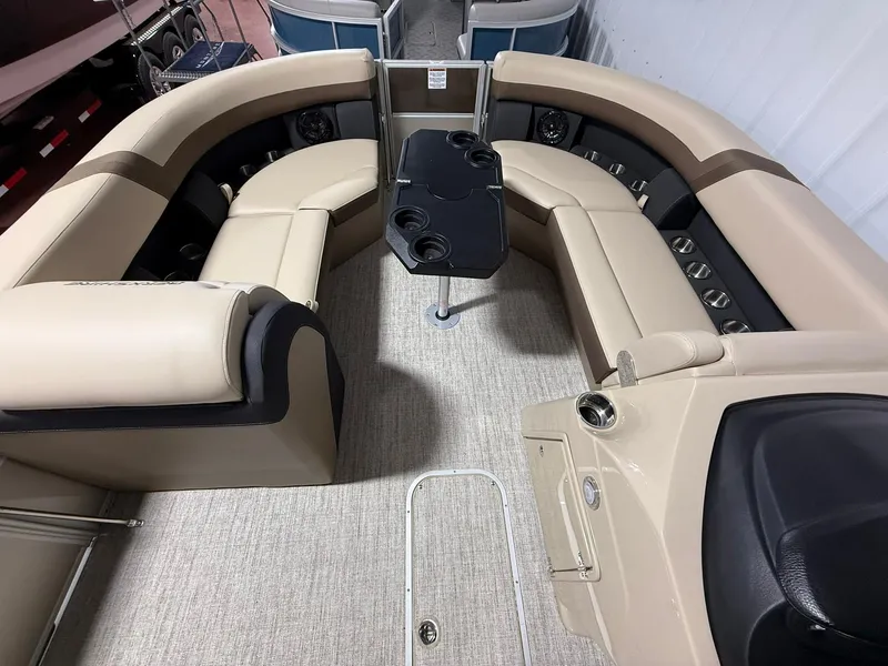 Slide: The Image of Interior of 2025 Berkshire 24CL CTS pontoon boat with beige seating and black table. - 7