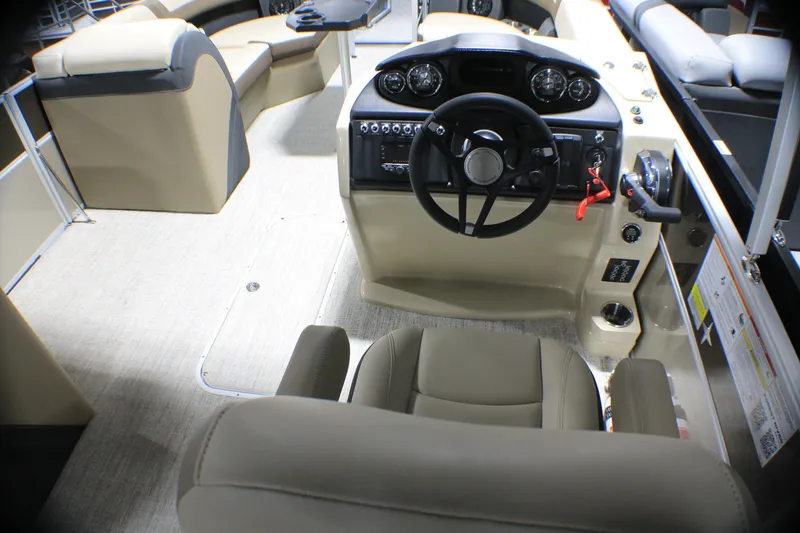 Slide: The Image of Interior of 2025 Berkshire 24CL CTS pontoon boat with steering console and seating. - 5
