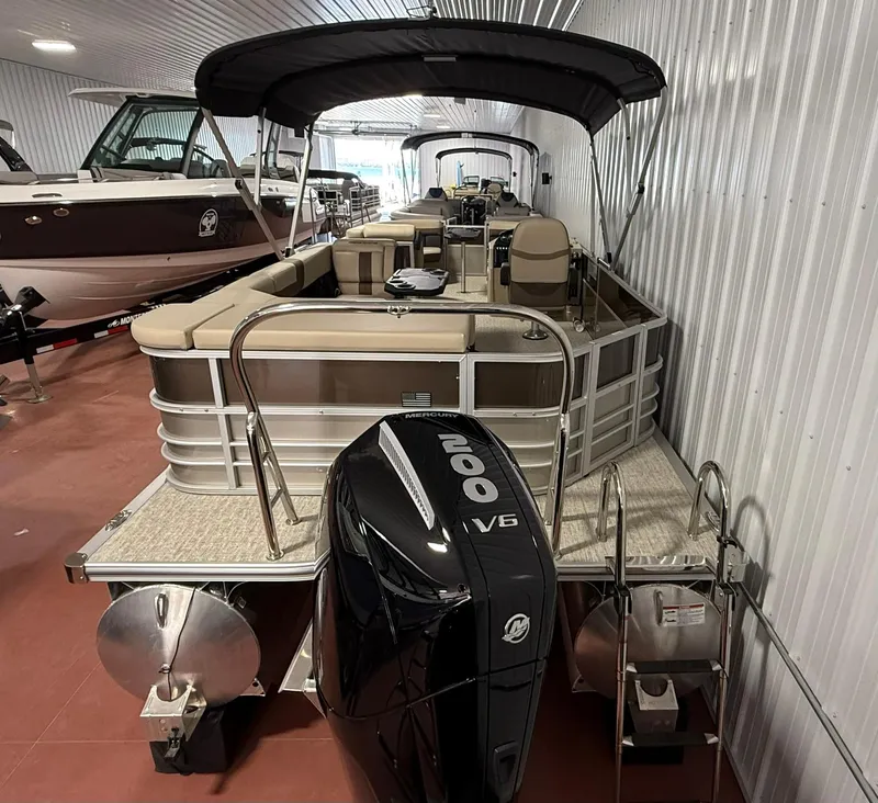 Slide: The Image of 2025 Berkshire 24CL CTS pontoon boat with Mercury 200 V6 engine in showroom. - 9