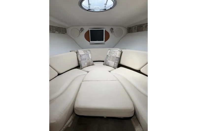 Slide: The Image of Luxurious interior of 2010 Crownline 280 CRX boat with plush seating and modern decor. - 14