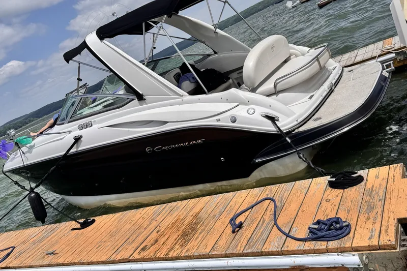 Slide: The Image of 2010 Crownline 280 CRX boat docked on a sunny day. - 9