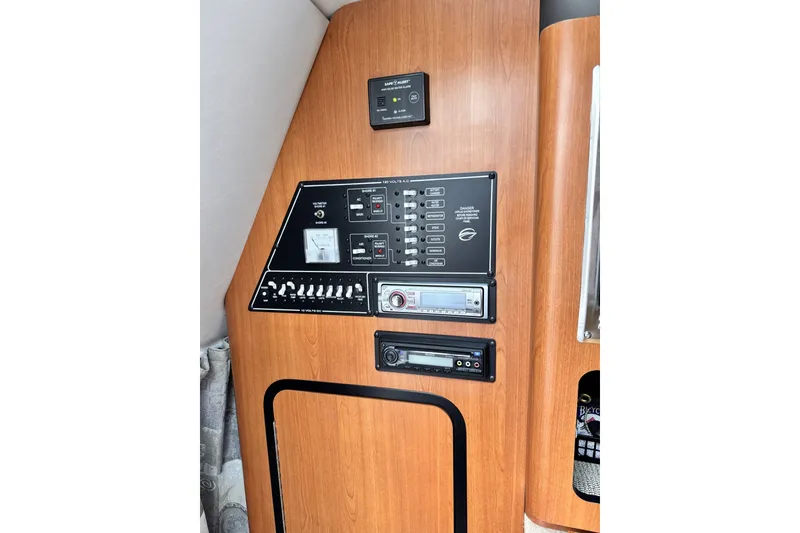 Slide: The Image of Control panel of a 2010 Crownline 280 CRX boat interior. - 11