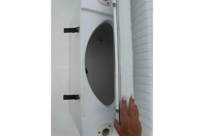 Slide: The Image of Open storage compartment on a 2003 Pro-Line 22 Sport boat. - 15