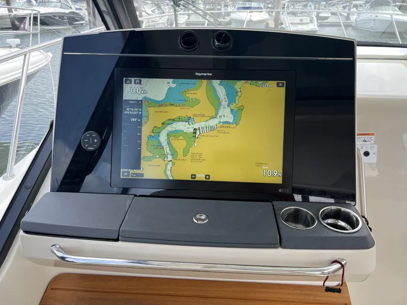 Slide: The Image of Dashboard of 2021 Boston Whaler 405 Conquest with navigation display. - 28