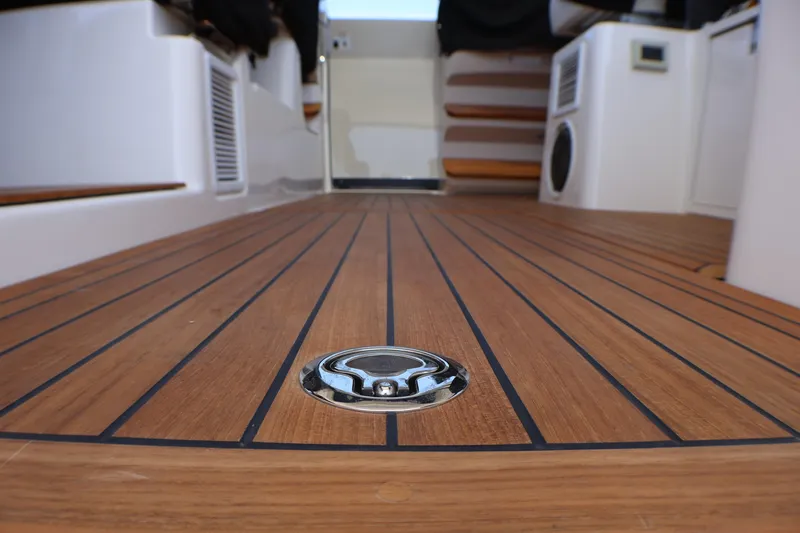 Slide: The Image of Teak deck of 2021 Boston Whaler 405 Conquest, showcasing sleek marine design. - 2