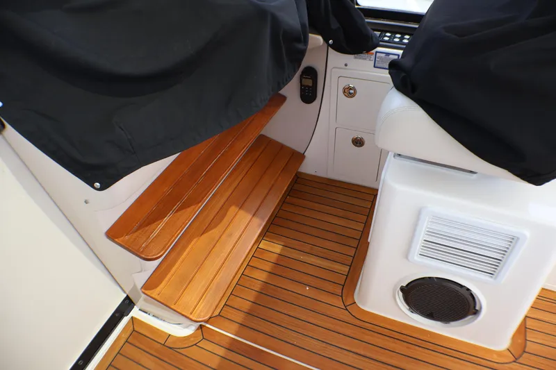 Slide: The Image of Interior of 2021 Boston Whaler 405 Conquest with wooden steps and seating area. - 42
