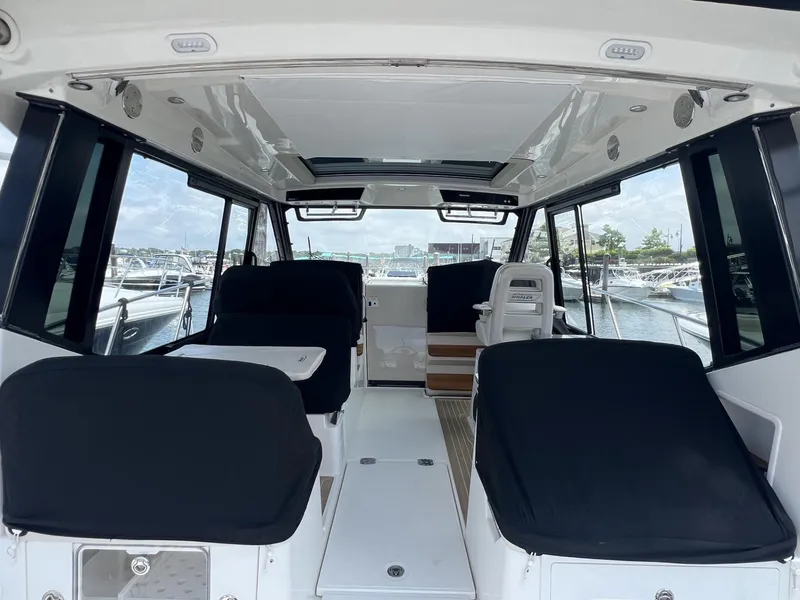 Slide: The Image of Interior view of 2021 Boston Whaler 405 Conquest boat, featuring spacious seating and modern design. - 24