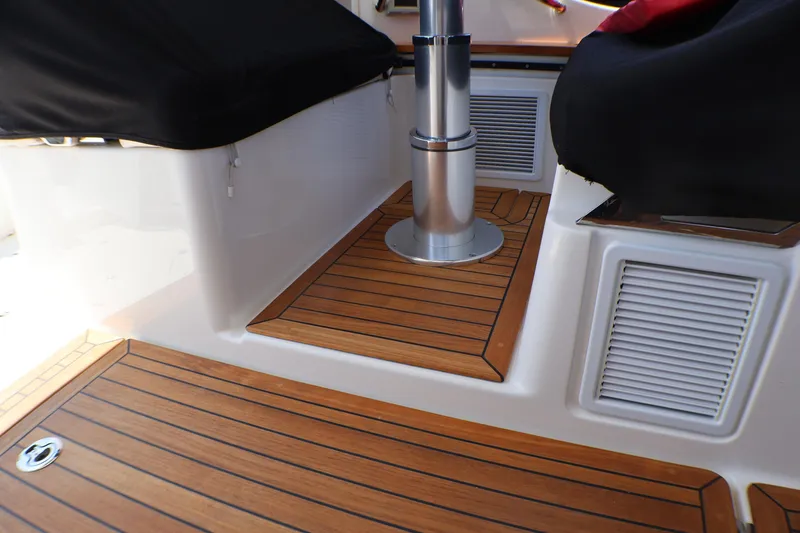 Slide: The Image of Teak deck detail on 2021 Boston Whaler 405 Conquest boat interior. - 39