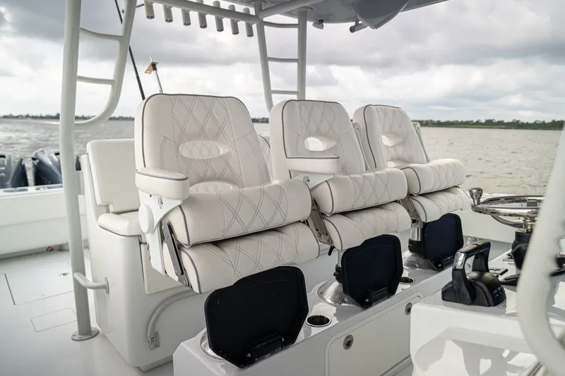 Slide: The Image of Luxurious seating on 2023 Contender 44 ST boat, featuring plush white upholstery and modern design. - 30