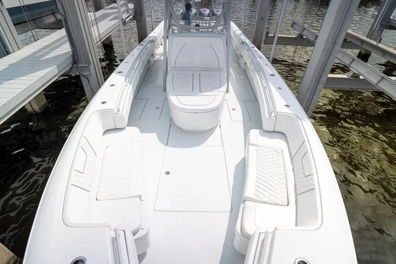 Slide: The Image of 2023 Contender 44 ST boat interior with white seating and spacious deck. - 16
