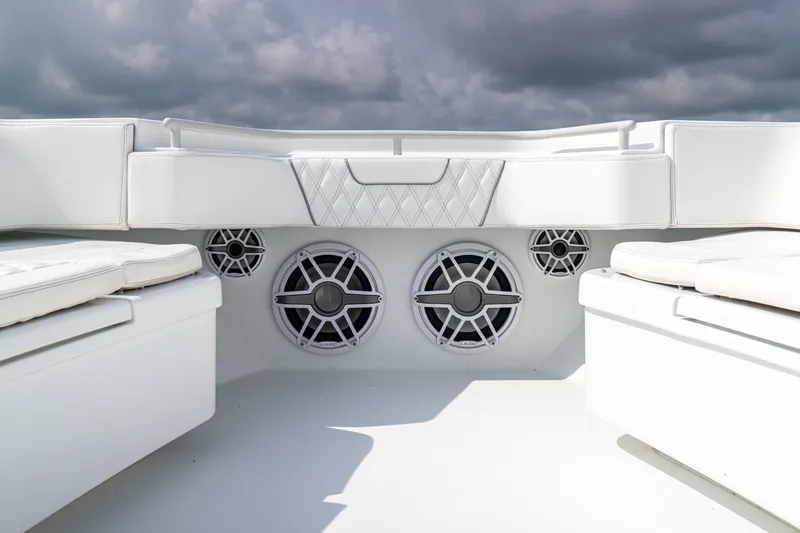Slide: The Image of 2023 Contender 44 ST boat interior with white seating and built-in speakers. - 25