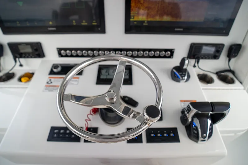 Slide: The Image of Helm of 2023 Contender 44 ST boat with modern controls and displays. - 33