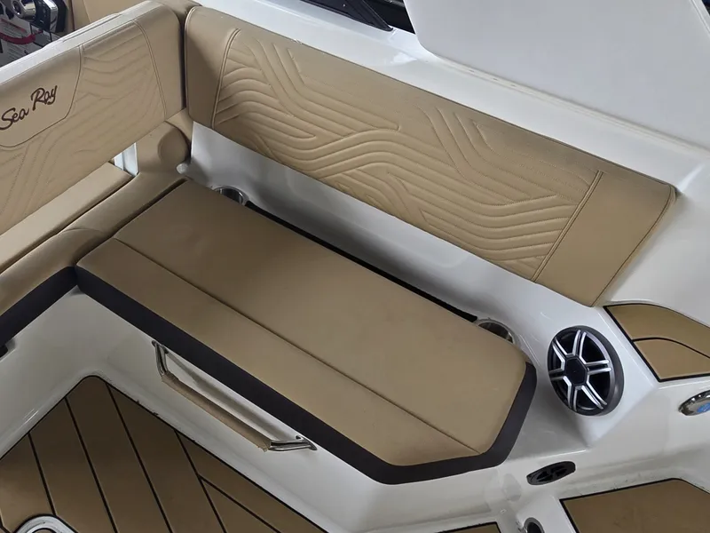 Slide: The Image of The 2027 Sea Ray SDX 270 Surf features stylish beige upholstery with elegant stitching. - 14