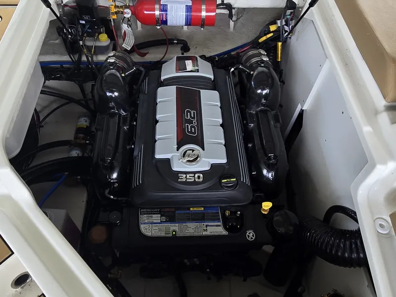 Slide: The Image of The engine compartment of a 2027 Sea Ray SDX 270 Surf features a powerful 6.2-liter engine. - 6