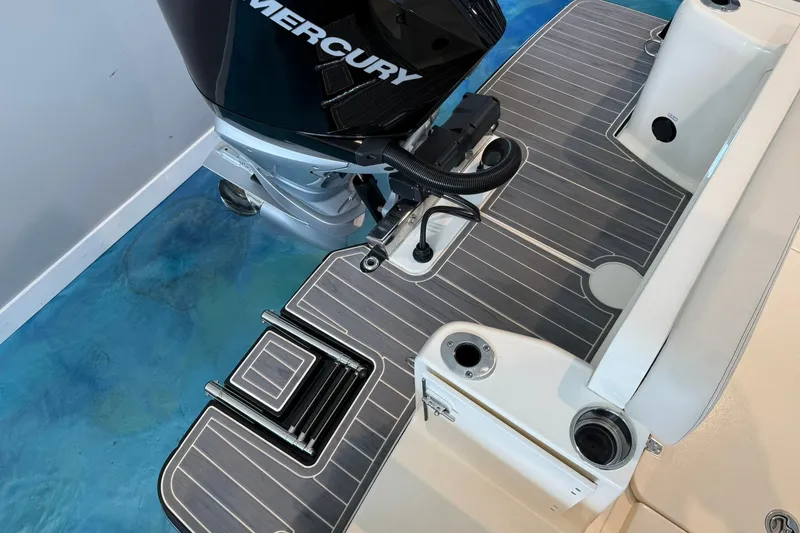Slide: The Image of 2026 Scout 240 Dorado boat with Mercury engine and sleek deck design. - 19
