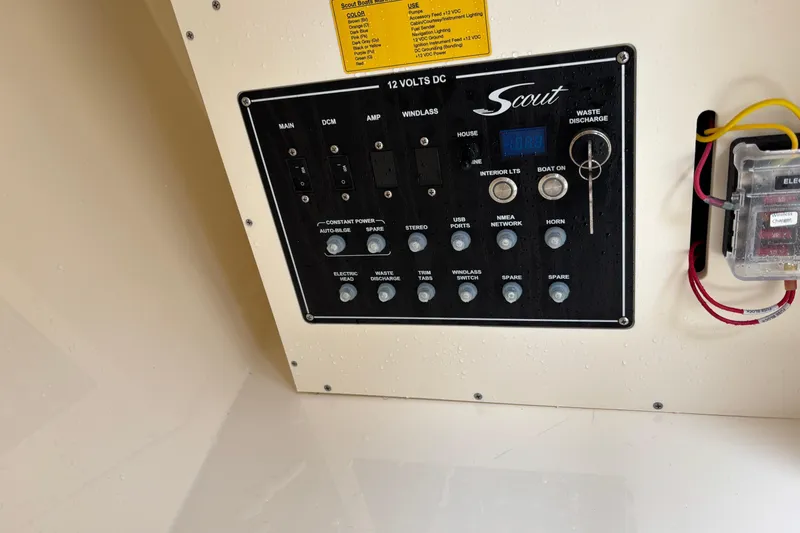 Slide: The Image of Control panel of 2026 Scout 240 Dorado boat with various switches and indicators. - 7