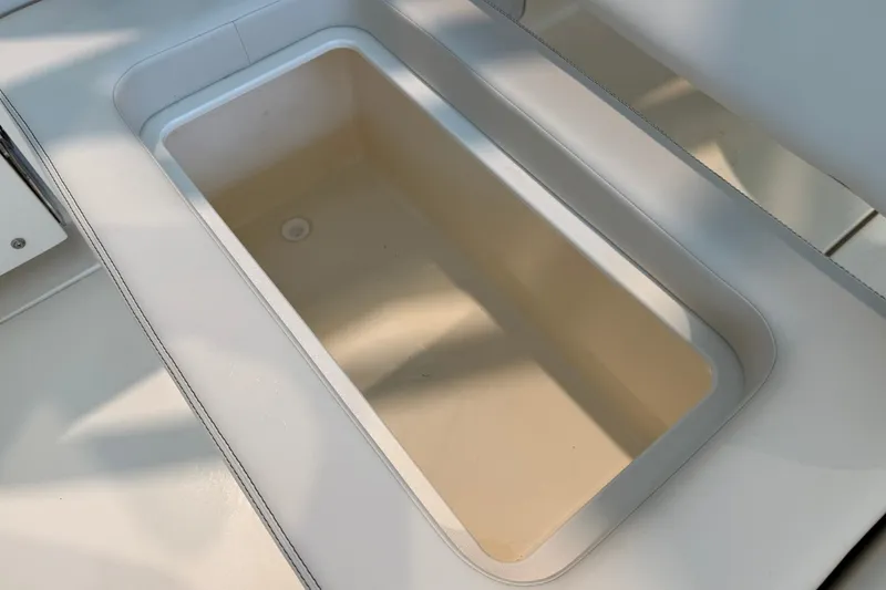 Slide: The Image of Storage compartment on 2026 Scout 240 Dorado boat, featuring sleek design and ample space. - 14