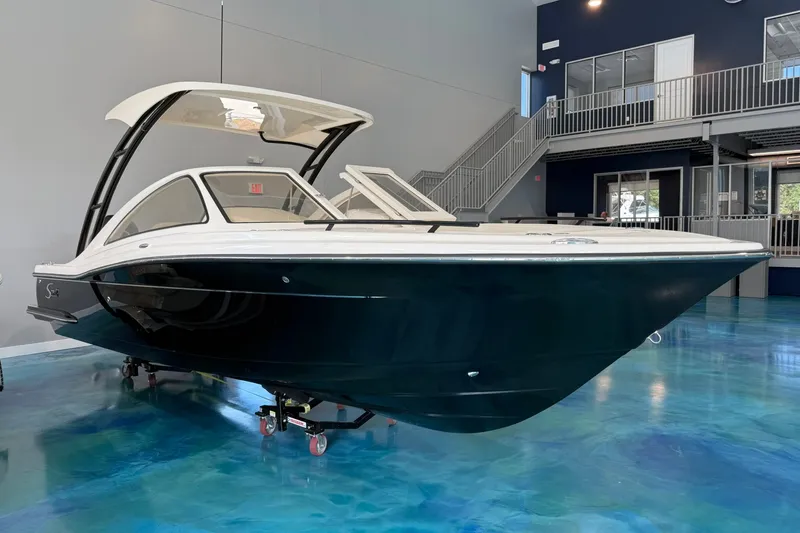 The Image of 2026 Scout 240 Dorado boat displayed indoors on a polished blue floor. - 0