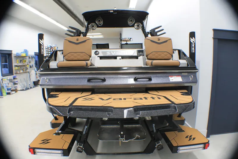 Slide: The Image of 2025 Varatti Z2373 boat interior with tan seats and sleek design in showroom. - 4
