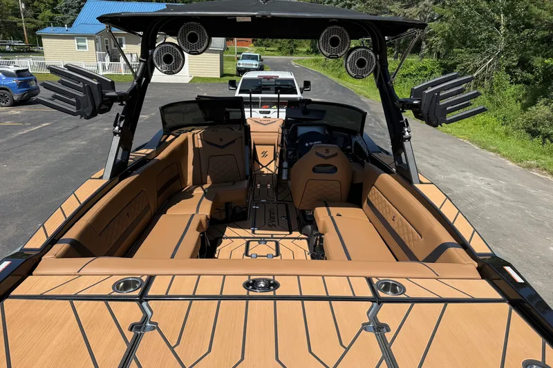 Slide: The Image of 2025 Varatti Z2373 boat interior with tan seating and advanced audio system. - 6