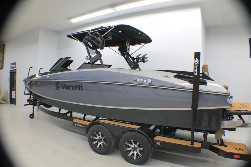 Slide: The Image of 2025 Varatti Z2373 boat on trailer in showroom, featuring sleek design and modern equipment. - 1