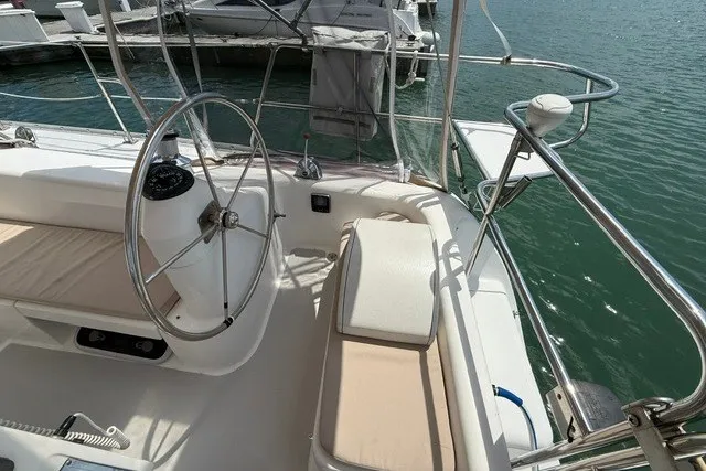 Slide: The Image of Cockpit of a 2005 Catalina 400 sailboat with steering wheel and seating. - 20