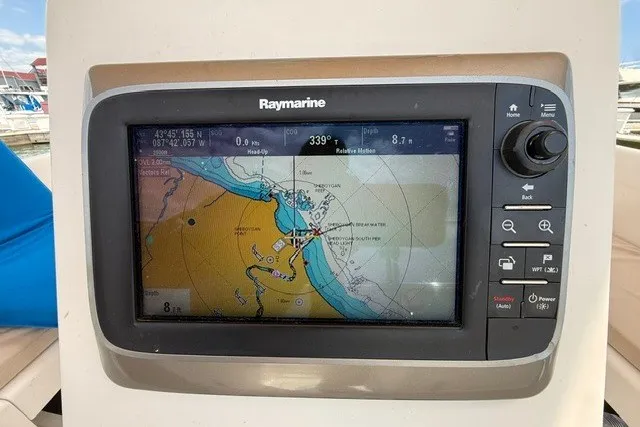 Slide: The Image of Raymarine navigation system on a 2005 Catalina 400 sailboat, displaying nautical chart. - 30