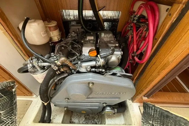 Slide: The Image of Engine compartment of a 2005 Catalina 400 sailboat, featuring a Yanmar engine. - 57