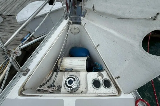 Slide: The Image of 2005 Catalina 400 sailboat anchor locker with winch and ropes on deck. - 7
